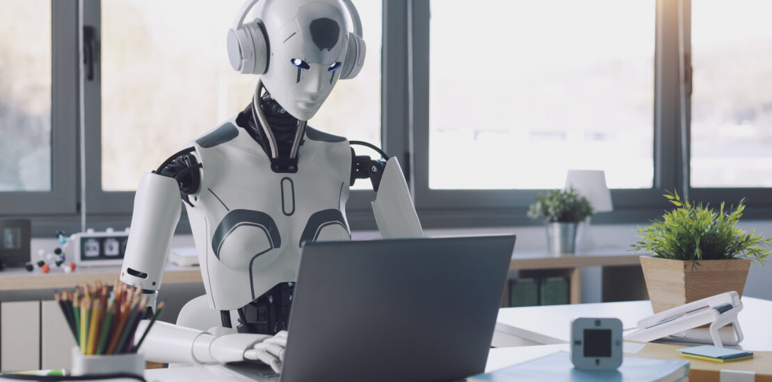 A humanoid robot works in an office on a laptop to listening Music in  Headphone, showcasing the utility of automation in repetitive and tedious tasks.